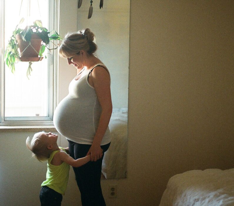 Mom and daughter maternity photo