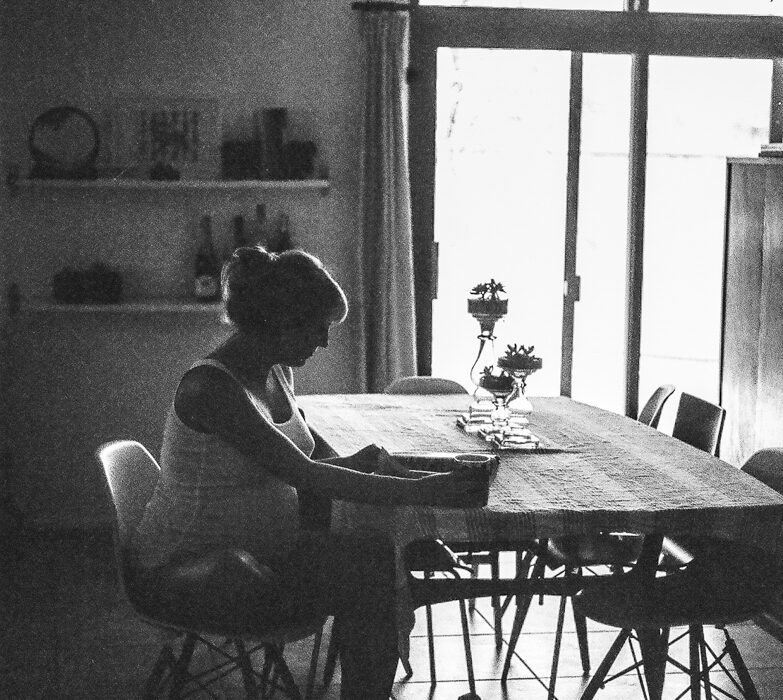 Pregnant woman sitting at table